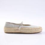 White leather espadrille flat with a braided jute sole and a buckled strap across the top edge