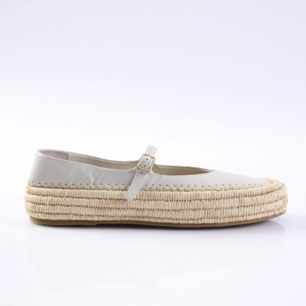 White leather espadrille flat with a braided jute sole and a buckled strap across the top edge