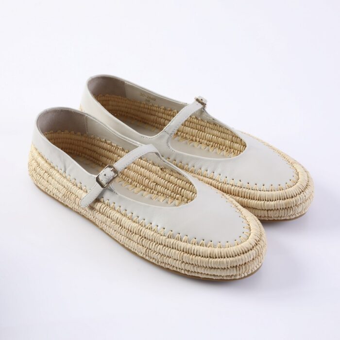 White leather Mary Jane espadrille shoes with a braided jute sole and buckle strap.