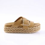 Tan platform sandal with a braided espadrille-style sole and a wide tan leather strap featuring a silver buckle