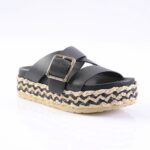 Black double-strap platform sandal with gold buckle and woven jute sole, viewed from side.