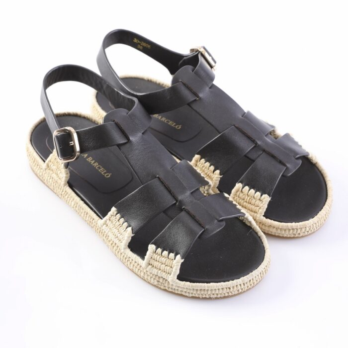 Pair of black leather sandals with a woven espadrille sole and ankle buckle, shown from above.