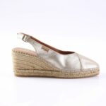 Silver metallic espadrille wedge sandal with ankle strap and braided jute sole.