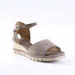 Beige suede open-toe sandal with ankle strap and braided espadrille wedge.