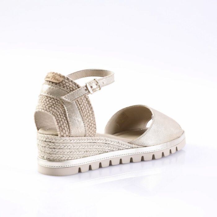 Beige metallic platform sandal with a braided espadrille-style wedge and ankle strap with buckle.