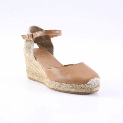 Tan leather espadrille wedge sandal with an ankle strap and woven jute sole.