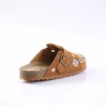 Brown suede open-back sandal with a buckle, decorative white patterns, and a cork-like sole.