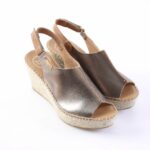 Bronze metallic peep-toe wedge espadrille sandals with ankle straps and braided jute sole.