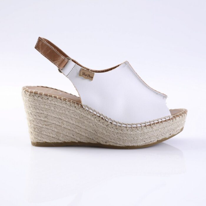 White leather wedge sandal with a jute espadrille platform and ankle strap.