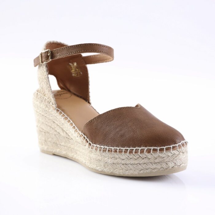 Brown leather espadrille wedge sandal with ankle strap and braided jute sole.