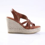 Brown leather wedge sandal with braided jute espadrille sole and open toe.