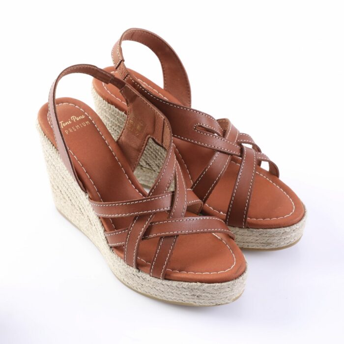 Brown leather wedge sandals with braided jute platform and white stitched seams, open-toe with ankle strap