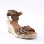Brown woven leather wedge espadrille with ankle strap and buckle on a jute sole