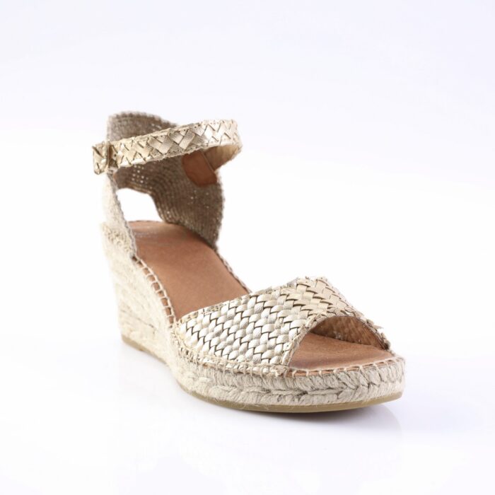 Gold-toned woven espadrille wedge sandal with ankle strap and braided sole, viewed from the side.